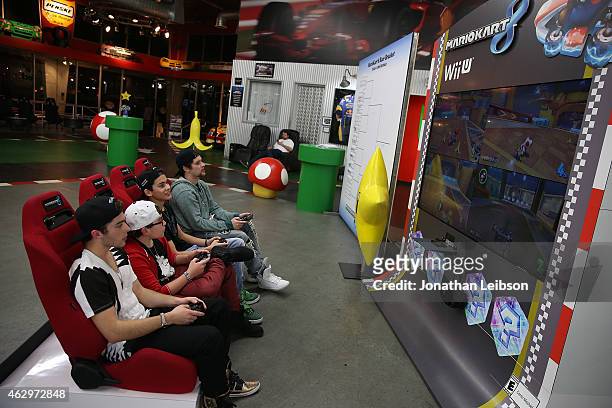 Guests playing MarioKart at the Dylan Riley Snyder Races Into His 18th Year With Nintendo at K1 Speed on February 7, 2015 in Gardena, California.