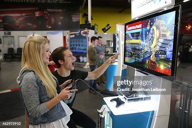 Olivia Holt and Leo Howard attend the Dylan Riley Snyder Races Into His 18th Year With Nintendo at K1 Speed on February 7, 2015 in Gardena,...