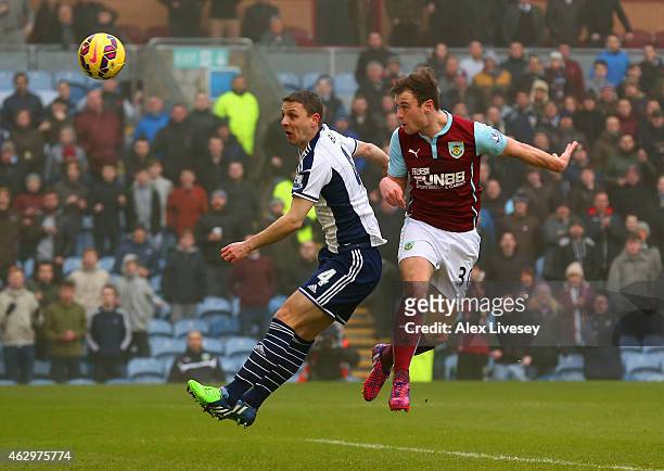 Ashley Barnes of Burnley heads in the opening goal during the Barclays Premier League match between Burnley and West Bromwich Albion at Turf Moor on...
