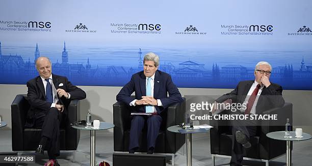 French Foreign Minister Laurent Fabius, US Secretary of State John Kerry and German Foreign Minister Frank-Walter Steinmeier attend a panel...