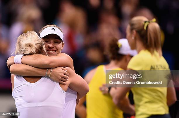 Angelique Kerber of Germany celebrates with team captain Barbara Rittner after her single match against Samantha Stosur of Australia during the Fed...