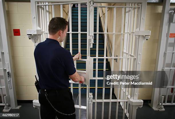 Door is closed by a prison guard at the Cookham Wood Young Offenders Institution on January 16, 2014 in Rochester, England. Mr Clegg has announced a...