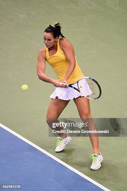 Jarmila Gajdosova of Australia plays a backhand in her single match against Andrea Petkovic of Germany during the Fed Cup 2015 World Group First...