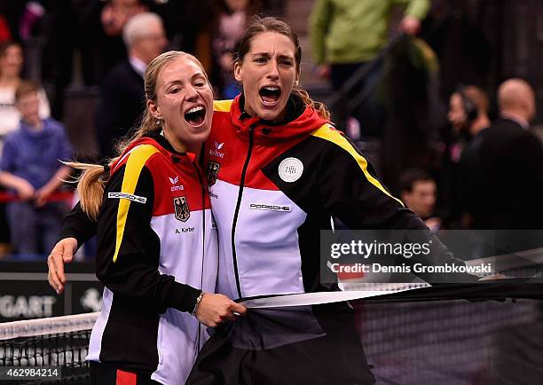Angelique Kerber and Andrea Petkovic of Germany celebrate after their victory in the Fed Cup 2015 World Group First Round tennis between Germany and...