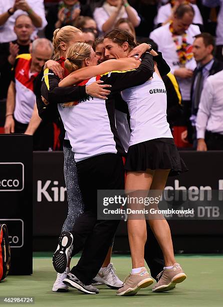 Andrea Petkovic of Germany celebrates with team mates after her victory in her single match against Jarmila Gajdosova of Australia during the Fed Cup...