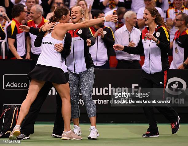 Andrea Petkovic of Germany celebrates with team mates after her victory in her single match against Jarmila Gajdosova of Australia during the Fed Cup...