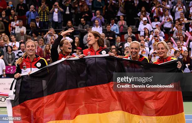 Germany team Angelique Kerber, Andrea Petkovic, Julia Goerges, Sabine Lisicki and captain Barbara Rittner celebrate after their victory in the Fed...