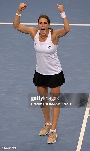 Germany's Andrea Petkovic celebrates after defeating Australia's Jarmila Gajdosova by 6-3, 3-6, 8-6 in their tennis match of the FedCup World Group...
