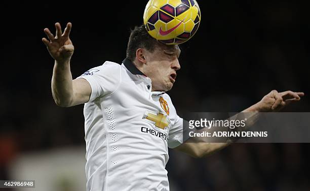 Manchester United's English defender Phil Jones heads the ball during the English Premier League football match between West Ham United and...