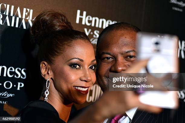 Holly Robinson Peete and Rodney Peete take a selfie at the Hennessy Toasts Achievements In Music With GRAMMY Awards Host LL COOL J And NFL Hall Of...