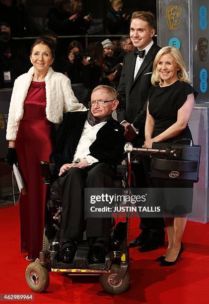 British scientist Stephen Hawking arrives on the red carpet with former wife Jane Hawking and daughter Lucy Hawking for the BAFTA British Academy...