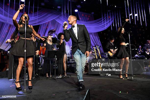 Pharrell Williams performs onstage at Pre-GRAMMY Gala And Salute To Industry Icons Honoring Martin Bandier at The Beverly Hilton on February 7, 2015...