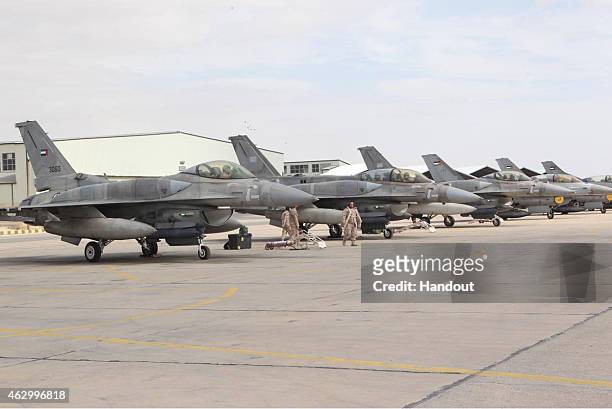 This handout picture released by the official Jordanian news agency, PETRA on February 8 shows a squadron of United Arab Emirates F-16 fighters...