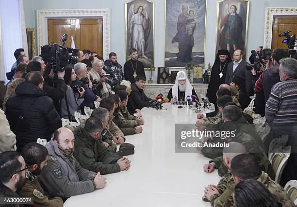 Former president of Georgia Mikheil Saakashvili and Patriarch Filaret attend a ceremony held for the 29 volunteer Georgian people fighting against...