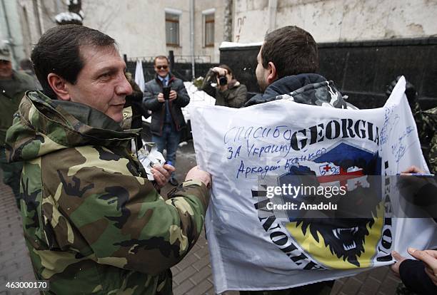 Flag of Georgian legion is signed after a ceremony held for the 29 volunteer Georgian people fighting against the pro-Russian separatists, in Kiev,...