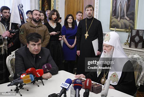 Former president of Georgia Mikheil Saakashvili and Patriarch Filaret attend a ceremony held for the 29 volunteer Georgian people fighting against...