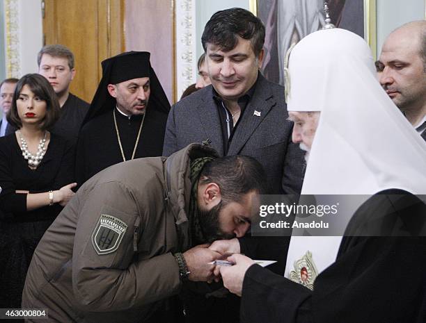 Former president of Georgia Mikheil Saakashvili and Patriarch Filaret attend a ceremony held for the 29 volunteer Georgian people fighting against...