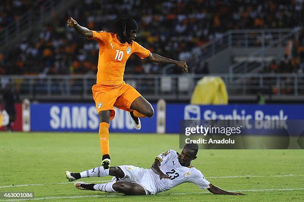 Kouassi Gervinho of Ivory Coast in action against Harrison Afful of Ghana during the Africa Cup of Nations final match between Ivory Coast and Ghana...