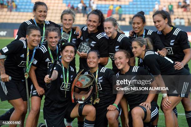 New Zealand's players pose for a selfie after winning the IRB Women's Sevens World Series final match against Australia in Barueri, some 30 km from...