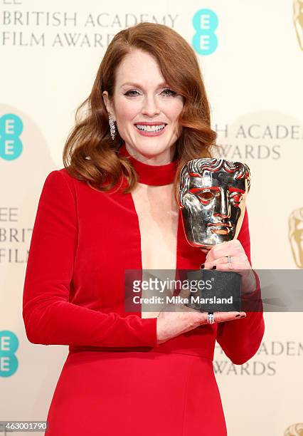 Actress Julianne Moore, winner of the Best Leading Actress award for the movie 'Still Alive' poses in the winners room at the EE British Academy Film...