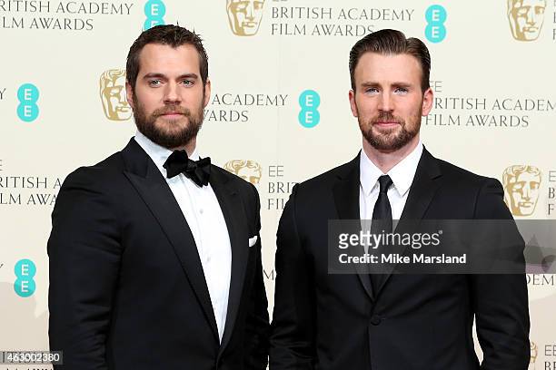 Presenters Henry Cavill and Chris Evans pose in the winners room at the EE British Academy Film Awards at The Royal Opera House on February 8, 2015...