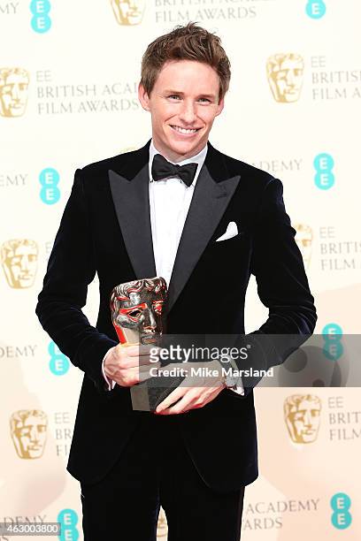Actor Eddie Redmayne, winner of the Best Leading Actor award for 'The Theory Of Everything' poses in the winners room at the EE British Academy Film...