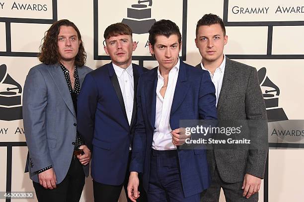 Recording artists Nick O'Malley, Jamie Cook, Alex Turner, and Matt Helders of music group Arctic Monkeys attend The 57th Annual GRAMMY Awards at the...