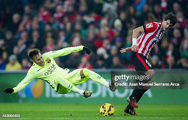 Neymar of FC Barcelona duels for the ball with Mikel San Jose of Athletic Club during the La Liga match between Athletic Club and FC Barcelona at San...