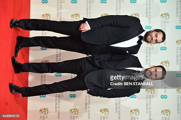 Presenters British actors Henry Cavill and Chris Evans pose together in the winners' area at the BAFTA British Academy Film Awards at the Royal Opera...