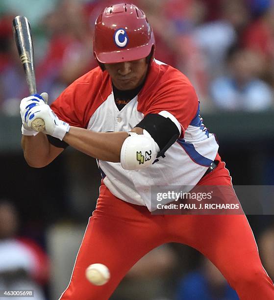 Cuba National baseball team infielder Frederich Cepeda watches a pitch sail by as he bats against the Mexico National baseball team in the final game...