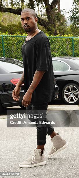 Kanye West, speculated to be wearing the Yeezy 3 sneakers 'Yeezy 750 Boost', arrives at the Roc Nation Grammy Brunch 2015 on February 7, 2015 in...