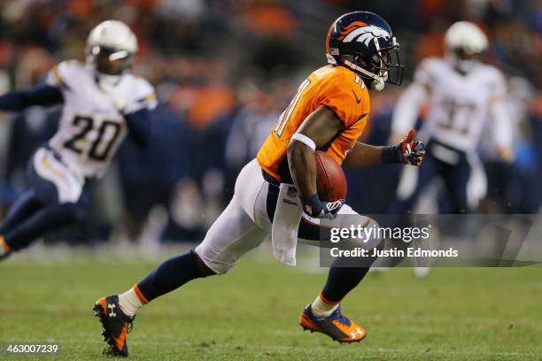 Trindon Holliday of the Denver Broncos carries the ball against the San Diego Chargers during the AFC Divisional Playoff Game at Sports Authority...