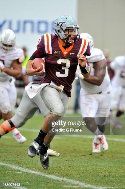 Logan Thomas of the Virginia Tech Hokies runs with the ball against the Maryland Terrapins at Lane Stadium on November 16, 2013 in Blacksburg,...