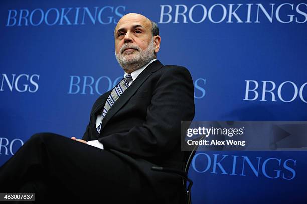 Federal Reserve Board Chairman Ben Bernanke sits during a session at the Brookings Institution January 16, 2014 in Washington, DC. Bernanke spoke on...