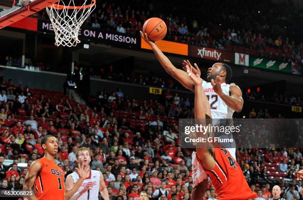 Dez Wells of the Maryland Terrapins drives to the hoop against the Oregon State Beavers at the Comcast Center on November 17, 2013 in College Park,...