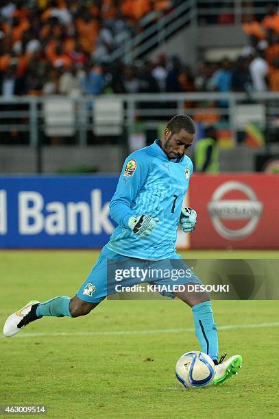 Ivory Coast's goalkeeper Boubacar Barry kicks the winning penalty during the penalty shootout of the 2015 African Cup of Nations final football match...