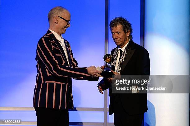 Filmmaker John Waters and musician Chick Corea speak onstage during the The 57th Annual GRAMMY Awards Premiere Ceremony at Nokia Theatre L.A. Live on...