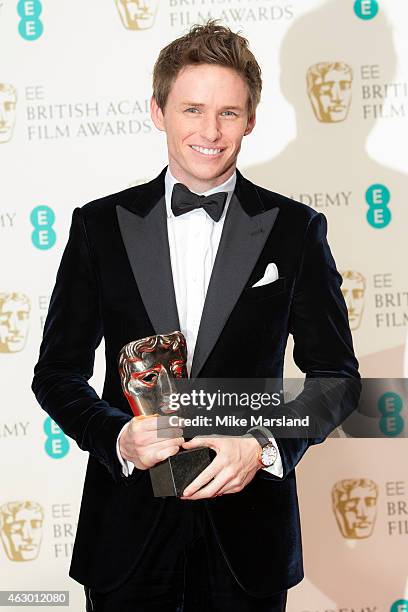 Actor Eddie Redmayne, winner of the Best Leading Actor award for 'The Theory Of Everything' poses in the winners room at the EE British Academy Film...