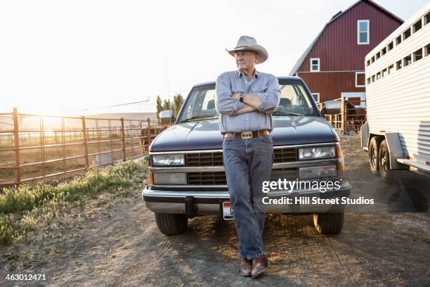 caucasian rancher standing against truck - rancher stock pictures, royalty-free photos & images