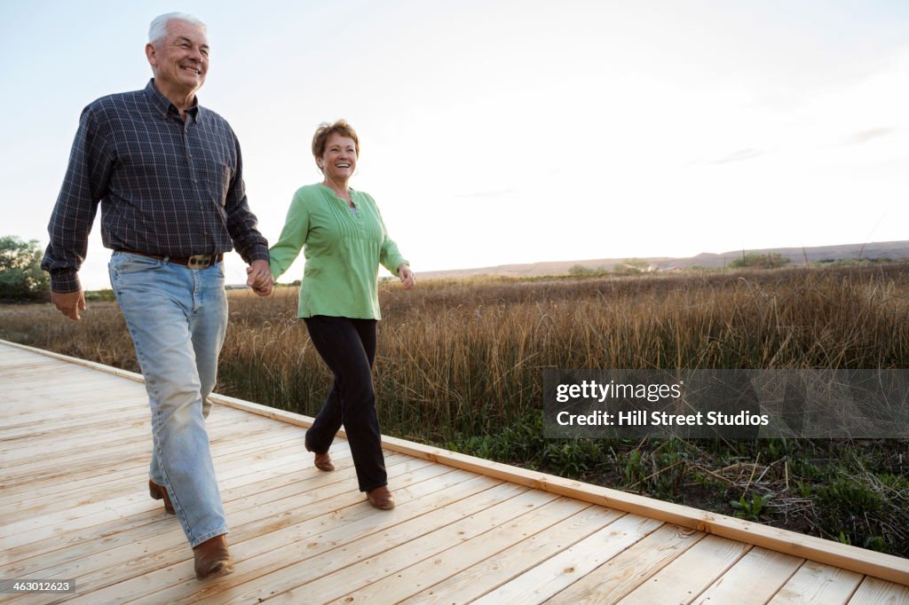 Caucasian couple on wooden walkway