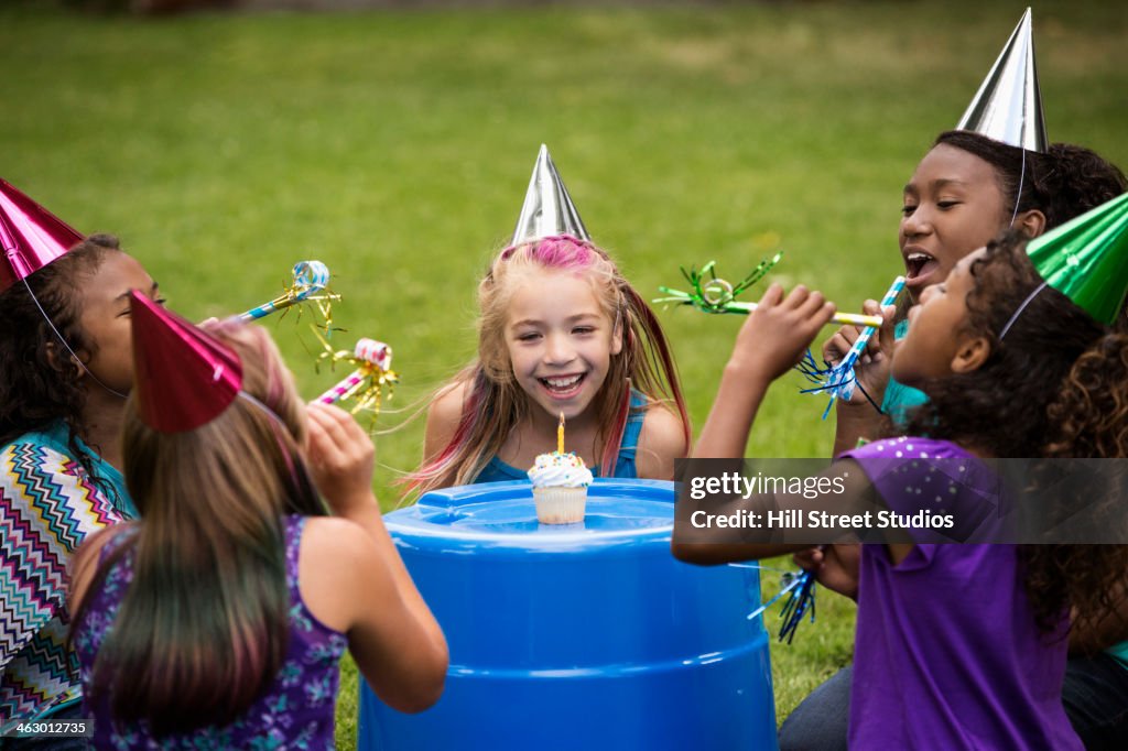 Girls celebrating birthday in backyard