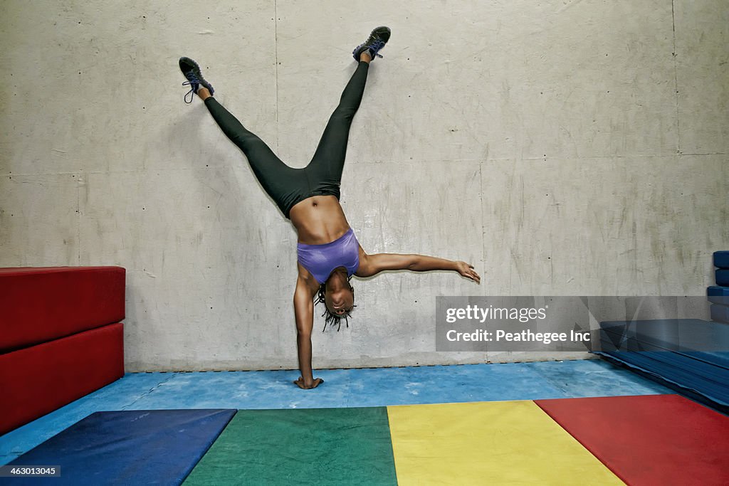 African American woman exercising in gym