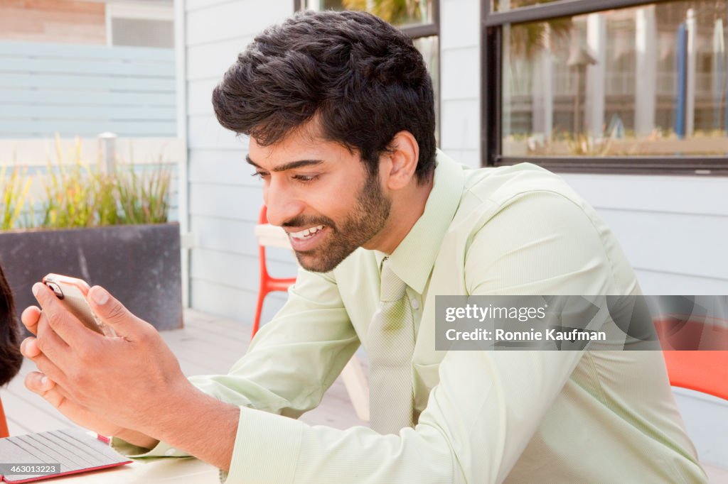 Man Using Mobile Device Indian Man Using Cell Phone High-Res Stock Photo - Getty Images