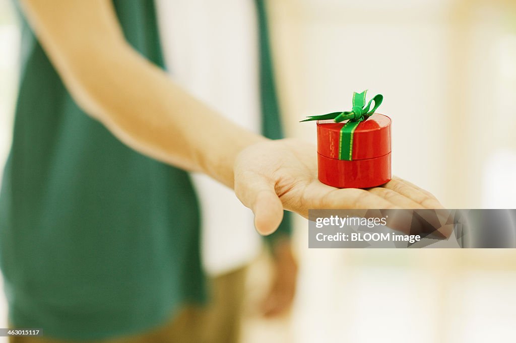 Man Holding Red Gift Box