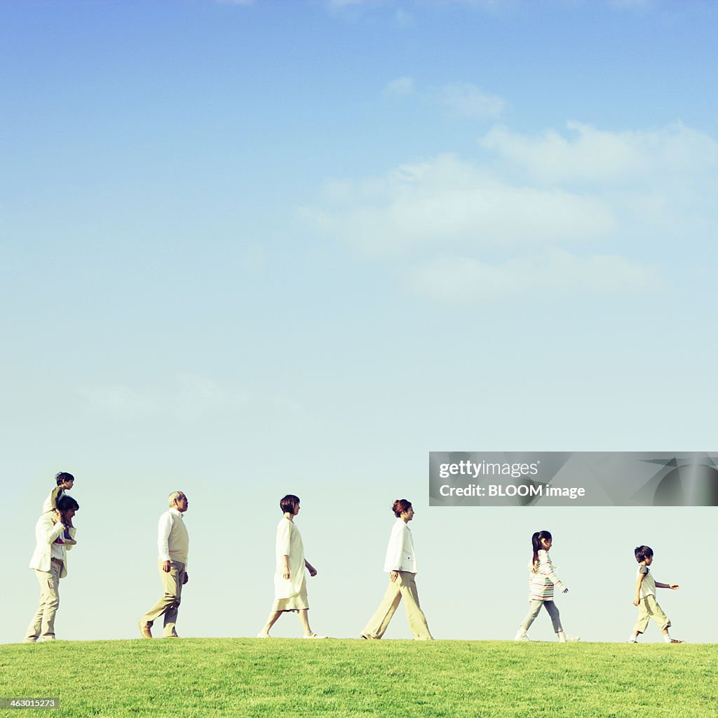 Multi-generation Family Walking In Park