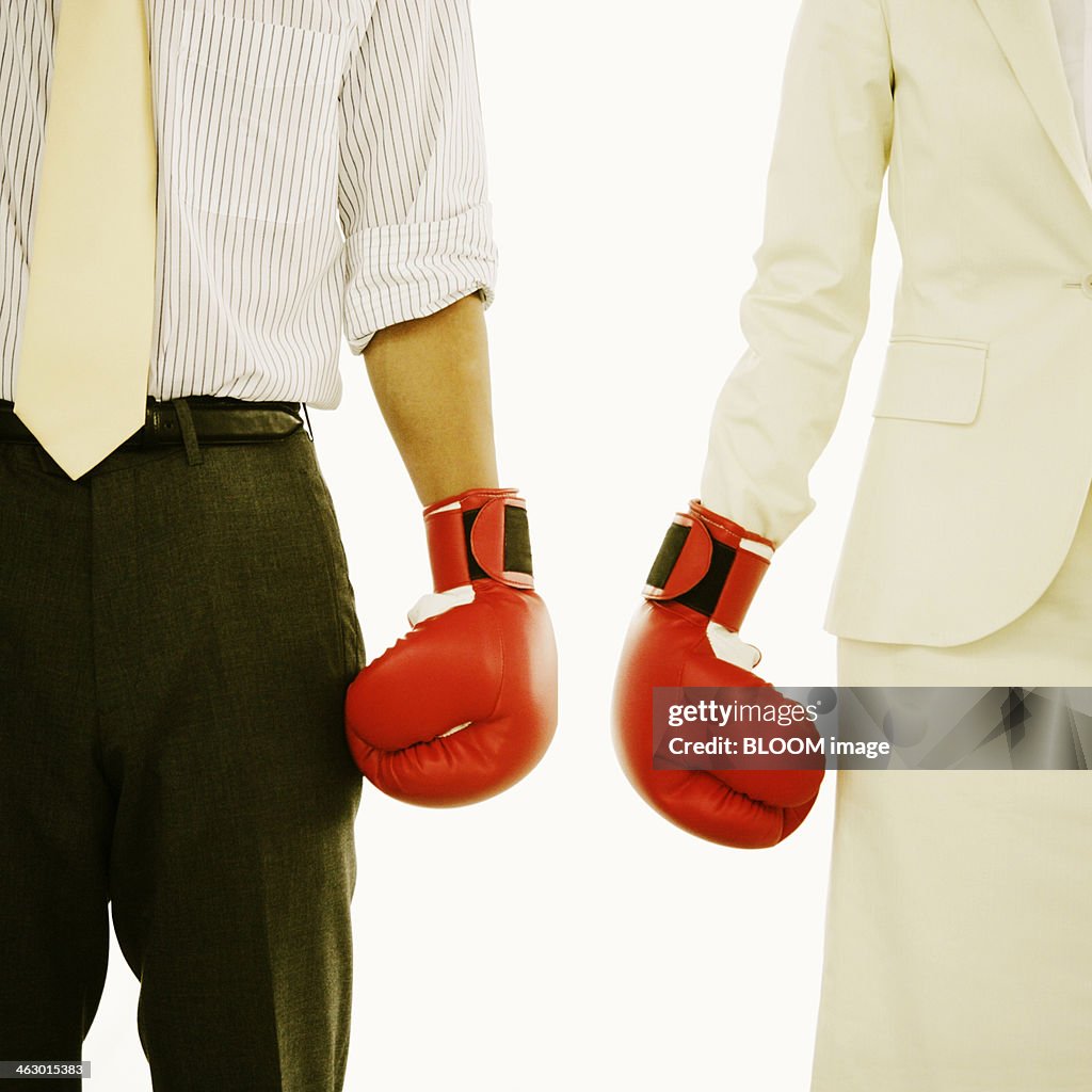 Two Business Couple Wearing Boxing Gloves