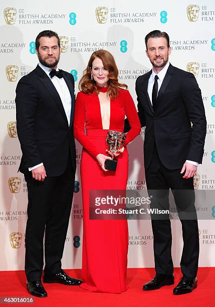 Presenters Henry Cavill , Chris Evans and actress Julianne Moore, winner of the Best Leading Actress award for the movie 'Still Alive' poses in the...