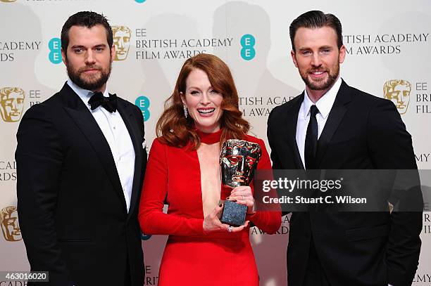 Presenters Henry Cavill , Chris Evans and actress Julianne Moore, winner of the Best Leading Actress award for the movie 'Still Alive' poses in the...