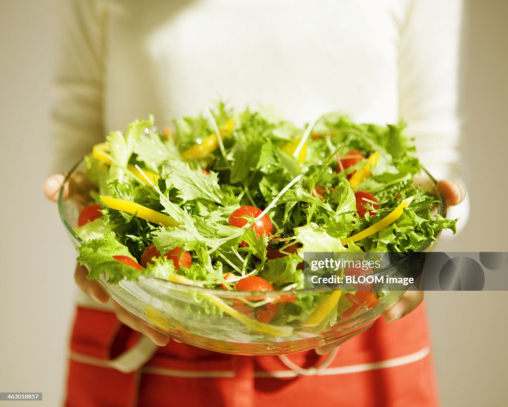 Woman Holding Bowl Of Salad