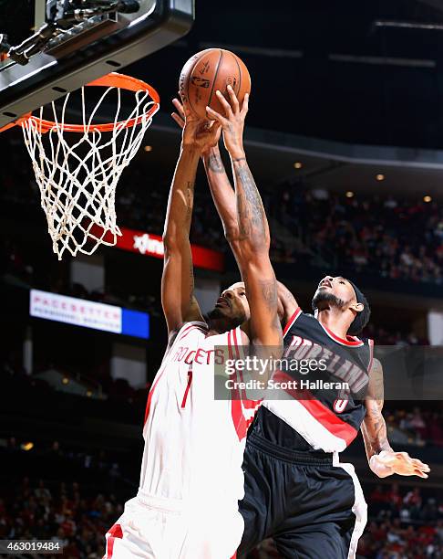 Will Barton of the Portland Trail Blazers blocks a shot behind Trevor Ariza of the Houston Rockets during their game at the Toyota Center on February...